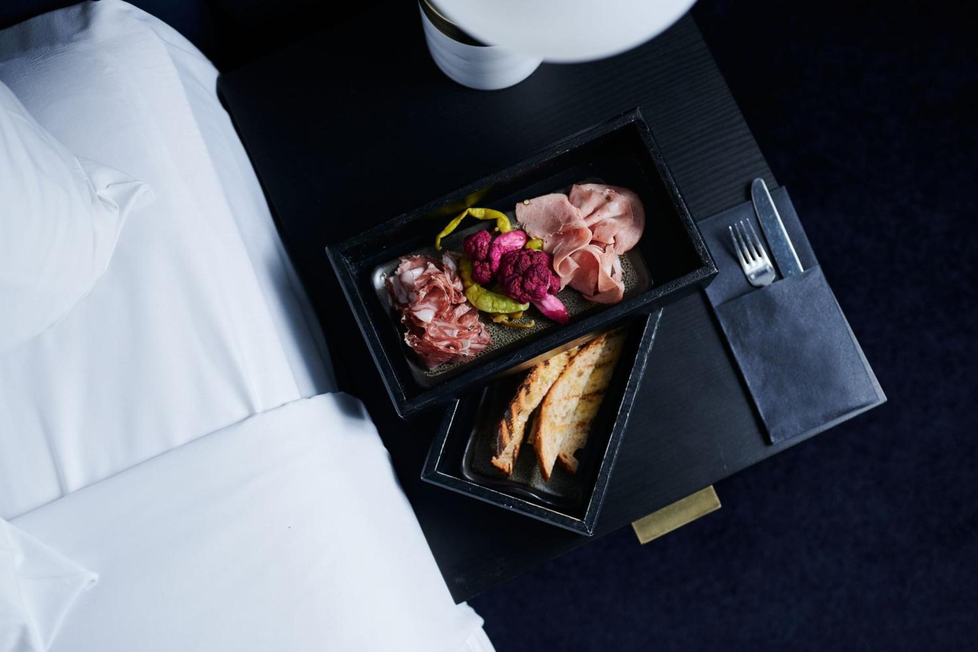 Midnight Hotel, Autograph Collection Канберра Экстерьер фото A first-class meal on board a Lufthansa plane